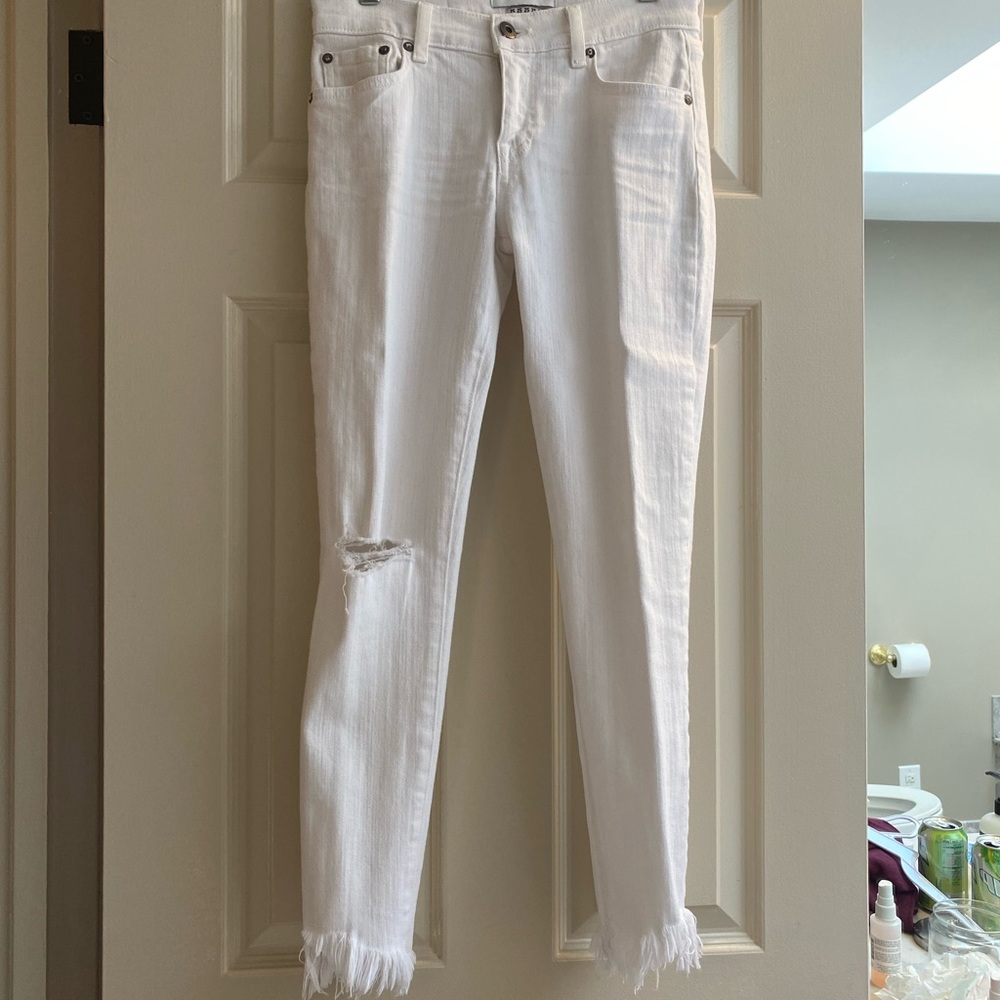 White jeans with a little fringe on the bottom